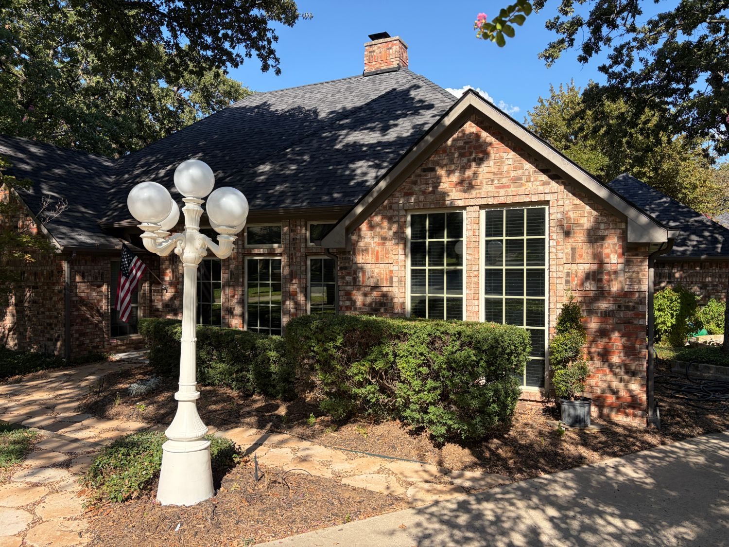 Brick home exterior after residential window tint install